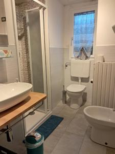 a bathroom with a toilet and a sink at Pedro Country House in Canossa +22 photos