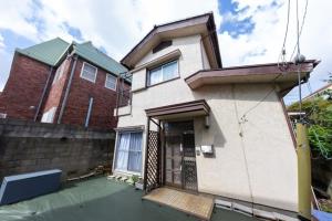 a house with its door open on a street at Setsuki no Yado - Vacation STAY 20324 in Kamagaya