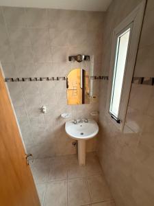 a bathroom with a sink and a mirror at RelaxMza in Mendoza