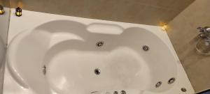 a large white bath tub in a bathroom at RelaxMza in Mendoza