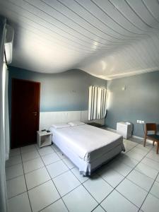 Postel nebo postele na pokoji v ubytování San Fernando Hotel