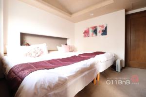 Voodi või voodid majutusasutuse NK Building 7th and 8th floors - Vacation STAY 66227v toas