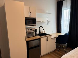 Kuchyň nebo kuchyňský kout v ubytování Loft Le Sommet