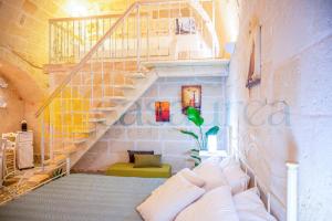 Giường trong phòng chung tại [Borgo Antico-Centro Storico] Casa Ventosa