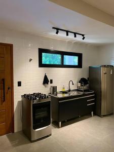 Kuchyň nebo kuchyňský kout v ubytování Villa Julião + 15 fotografií