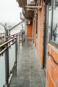 an empty hallway of a building with a window at Jessica luxury Apartament in Curtea de Argeş