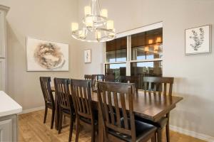 a dining room with a wooden table and chairs at The Lakeview Penthouse - 10ppl in Branson