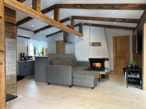 a living room with a couch and a fireplace at Cozy cabin with an amazing view in Åre