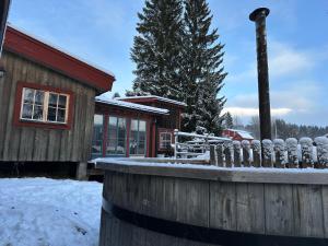 a house with a fence in the snow at Cozy cabin with an amazing view in Åre