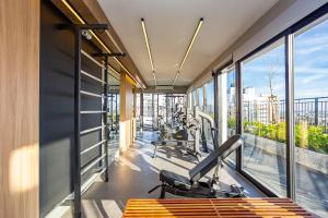 a gym with treadmills and cardio equipment in a building at My Place in Curitiba