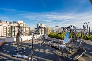 a row of exercise bikes on a roof at My Place in Curitiba +1 photo
