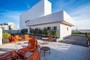 a group of chairs and tables on top of a building at My Place in Curitiba