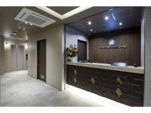 a lobby with a reception desk in a building at Hotel Reference Tenjin - Vacation STAY 80083v in Susakiuramachi