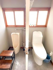 a bathroom with a toilet and a urinal at NOA - Vacation STAY 80085v in Shikyū
