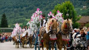 a group of people riding horses in a parade at Apartmánový Dom Terchová in Terchová