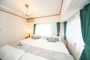 Postel nebo postele na pokoji v ubytování Awaji Egao Sakuie in Sumoto - Vacation STAY 81949v