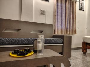 a table with a glass jug on top of it at The Hotel Eden Beach in Puducherry +32 photos