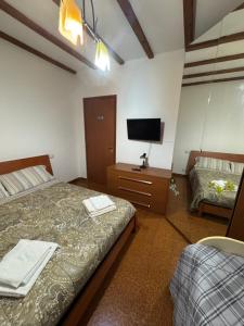 Ένα ή περισσότερα κρεβάτια σε δωμάτιο στο B&B DA Tony a 15 minuti da Malpensa