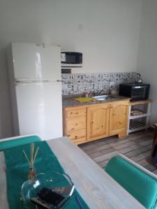 Η κουζίνα ή μικρή κουζίνα στο Refugio playero +5 φωτογραφίες