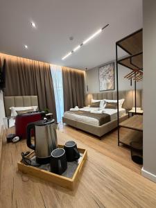 a bedroom with a bed and a tray with a tea kettle at Hotel Castle View in Krujë +153 photos