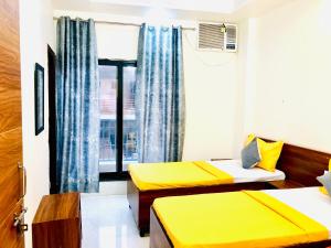 Ένα ή περισσότερα κρεβάτια σε δωμάτιο στο OOAK Knowledge Park +12 φωτογραφίες