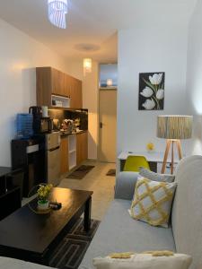 a living room with a couch and a table at Tsavo in Nairobi