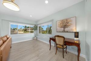 a living room with a desk and a couch at Family Hilltop luxe retreat with breathtaking views in La Mesa +30 photos
