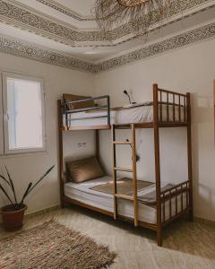 Postel nebo postele na pokoji v ubytování Dania Surf Appartement