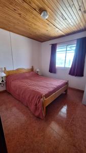 En eller flere senge i et værelse på Aiken Alojamiento