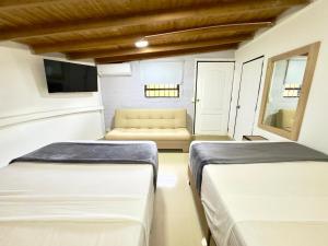 Postel nebo postele na pokoji v ubytování Hotel Estadio 80