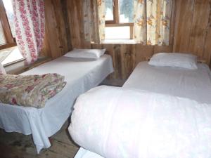 Ένα ή περισσότερα κρεβάτια σε δωμάτιο στο Paldor Peak Guest House