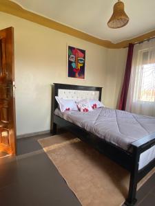 Ένα ή περισσότερα κρεβάτια σε δωμάτιο στο Nzuri Homes