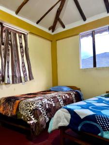 Postel nebo postele na pokoji v ubytování AUSANGATE LODGE 7 Lagunas