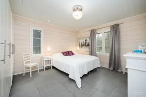 Postel nebo postele na pokoji v ubytování Villa Metsola