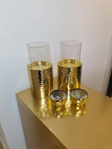 three glasses of wine sitting on top of a table at Jolie Hotel in Craiova