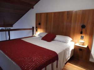 Ένα ή περισσότερα κρεβάτια σε δωμάτιο στο Casa da Pitanga Lumiar