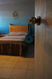 a door to a bedroom with a bed at Casa del Árbol Xochimilco in Oaxaca City +73 photos