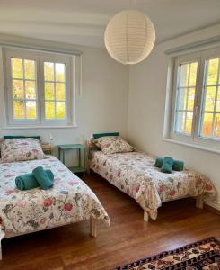 En eller flere senge i et værelse på La maison d'Yvonne + 32 billeder