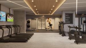 a gym with cardio equipment and a woman running on a treadmill at Soho Plaza Hotel in Brasília +14 photos