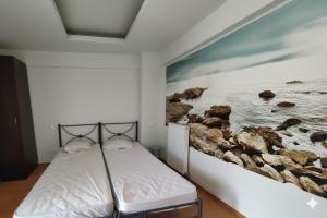 Ένα ή περισσότερα κρεβάτια σε δωμάτιο στο Little Park