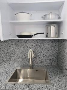 Kuchyň nebo kuchyňský kout v ubytování Desconecta para volver a conectar