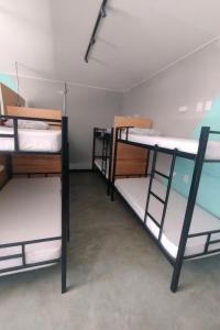 a group of bunk beds in a room at O Ogro in Brasilia