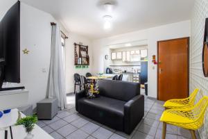 Et opholdsområde på Apto Pet Friendly com Garagem na Enseada Azul