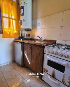 Η κουζίνα ή μικρή κουζίνα στο Tom y Luna Cabañas