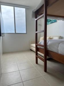 Ένα ή περισσότερα κρεβάτια σε δωμάτιο στο Sky's room Salinas San Lorenzo The Panoramic +45 φωτογραφίες