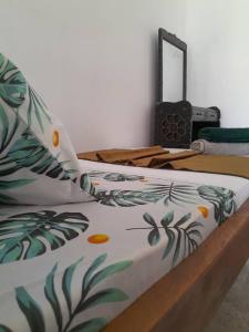 Ένα ή περισσότερα κρεβάτια σε δωμάτιο στο Amore Stone Town Zanzibar Apartment by Monalisa