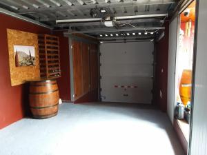 a garage with a door and a barrel at RUBYAi in Icod el Alto +30 photos