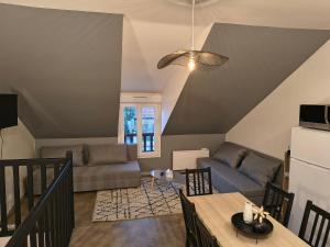 Μια τηλεόραση ή/και κέντρο ψυχαγωγίας στο Appartement La cabane perchée 9 personnes wifi