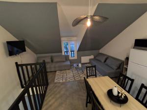 Μια τηλεόραση ή/και κέντρο ψυχαγωγίας στο Appartement La cabane perchée 9 personnes wifi