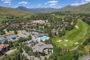 an aerial view of the resort with mountains in the background at Modern Golf View Condo + Resort Amenities in Sun Valley